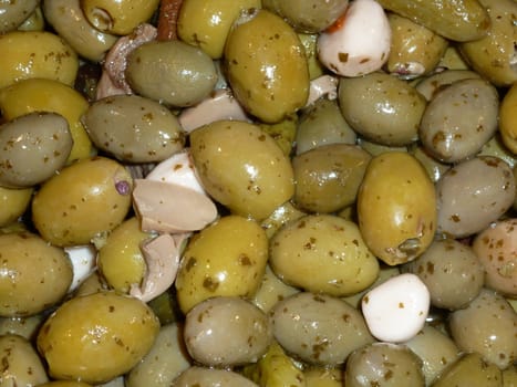 Fresh green olives with garlic and mushrooms