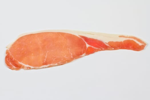 A single slice of raw back bacon