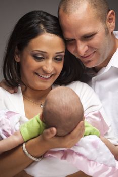 Happy Young Attractive Mixed Race Family with Newborn Baby.