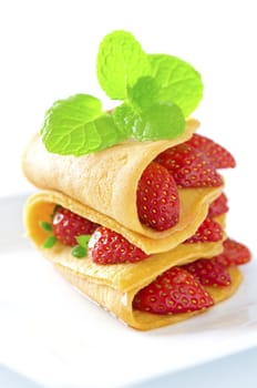 Strawberry crepe, mint leaf topping