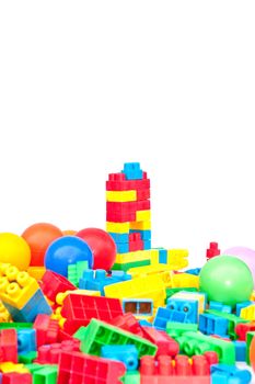 Plastic constructor bricks heap. isolated on white.