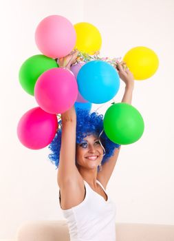 Girl clown with colourful balloons.