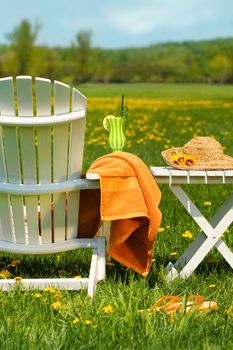 Adirondack chair in grass ready for relaxing outside