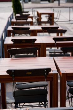 benches and tables outside of a restaurant