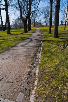 Road at a park spring time in Finland