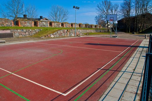 Basketball field on medieval scenery