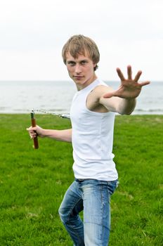 Martial arts: Man with nunchaku 