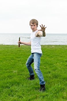 Martial arts: Man with nunchaku 