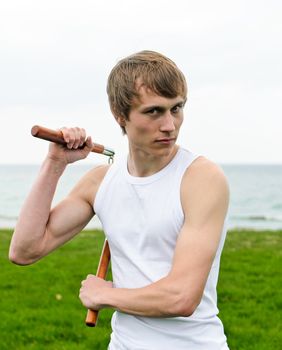 Martial arts: Man with nunchaku 