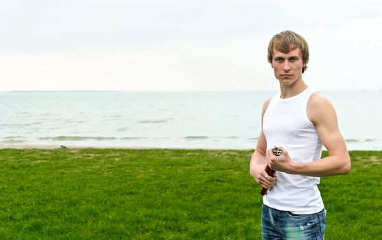 Martial arts: Man with nunchaku. Place for text.