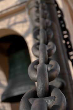 Closeup macro of a chains and a bell
