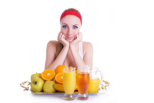 Sporty woman with fruits and juice over white
