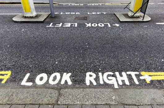 Lokk right warning painted on the tarmac in London, England, UK