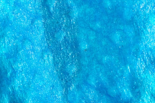 Picture of blue wet shiny texture with patterns