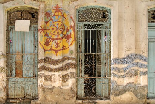 Abstract facade with windows in old Havana street, cuba