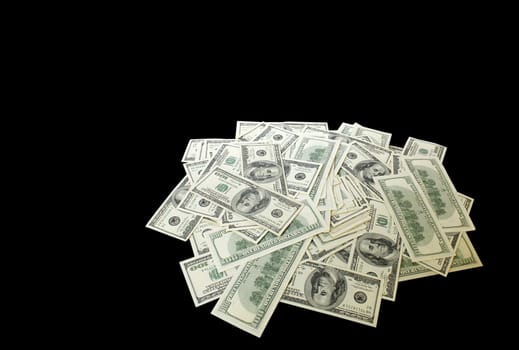 heap of banknotes (100 dollars) over black background