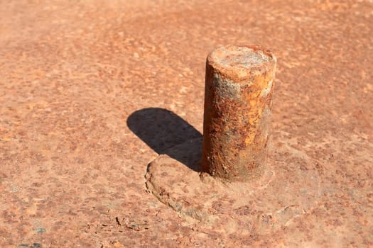 Metal pipe welded to the rusty metal platform