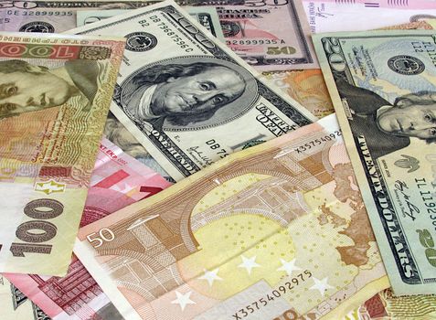 cash background : dollars , euros and hrivna