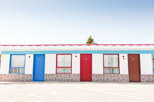 Motel with red and blue doors