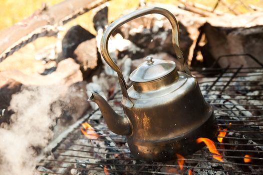 Kettle with water heated on the fire