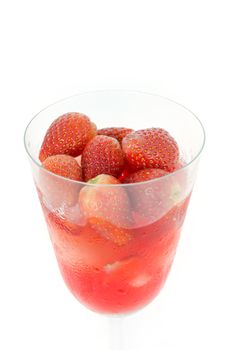 close up red  strawberry juice in glass over white