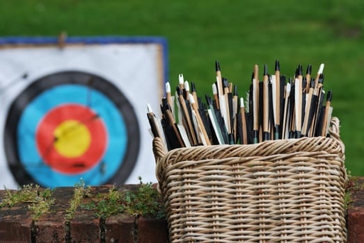 basket of arrows with target