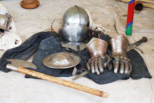 Medieval armour and axe on floor