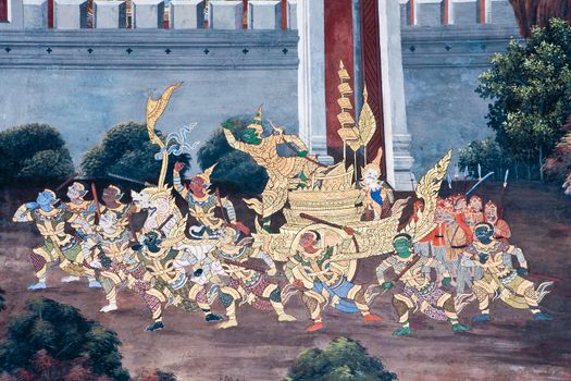 Thai Mural Painting on the wall, Wat Phra Kaew, Bangkok, Thailand (Ramayana story). The temple is created with money donated by people it is public domain and open to the public Visits.