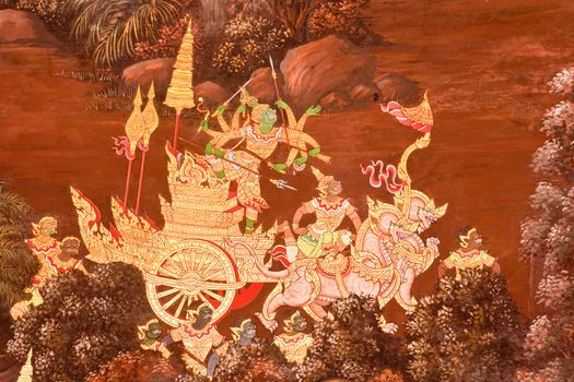 Thai Mural Painting on the wall, Wat Phra Kaew, Bangkok, Thailand (Ramayana story). The temple is created with money donated by people it is public domain and open to the public Visits.