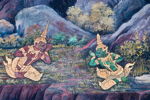 Thai Mural Painting on the wall, Wat Phra Kaew, Bangkok, Thailand (Ramayana story). The temple is created with money donated by people it is public domain and open to the public Visits.