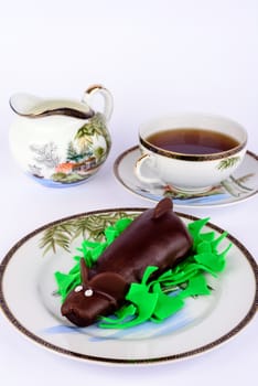 Chocolate cake with tea and milk.