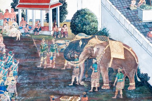 Thai Mural Painting on the wall, Wat Phra Kaew, Bangkok, Thailand (Ramayana story). The temple is created with money donated by people it is public domain and open to the public Visits.