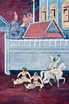 Thai Mural Painting on the wall, Wat Phra Kaew, Bangkok, Thailand (Ramayana story). The temple is created with money donated by people it is public domain and open to the public Visits.