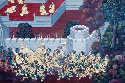 Thai Mural Painting on the wall, Wat Phra Kaew, Bangkok, Thailand (Ramayana story). The temple is created with money donated by people it is public domain and open to the public Visits.