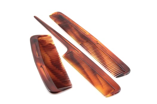 Three combs over white