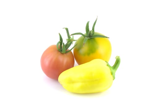 Tomatoes and pepper on white background