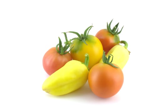 Tomatoes and peppers on white background