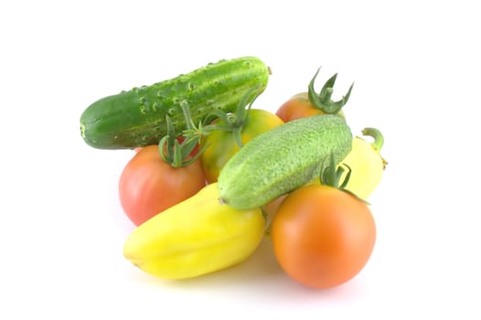 Cucumbers, tomatoes and peppers on white background