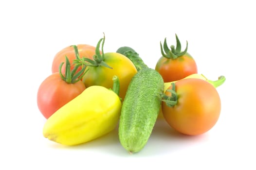 Cucumbers, tomatoes and pepper on white background