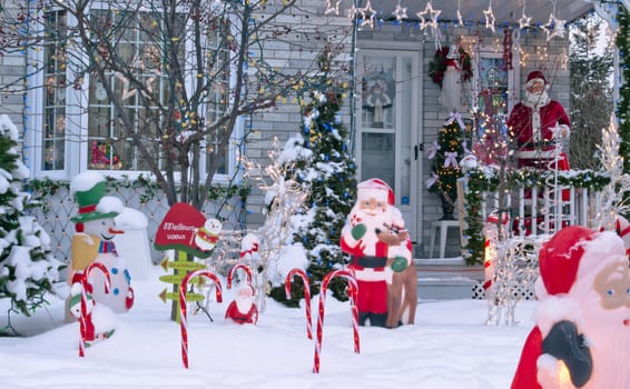 A home is decorated for Christmas with Santa Claus and candy canes.