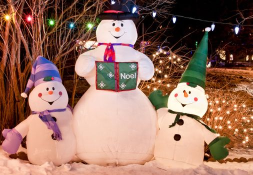 Three snowmen are lit up for the Holiday Season.