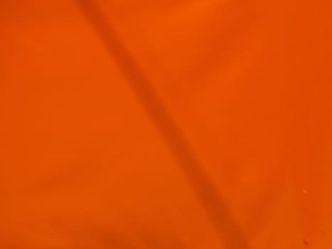 orange material with a shadow as a background