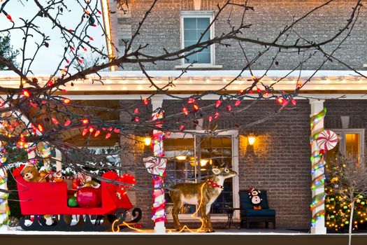 A home is decorated for the Holiday Season with a sleigh, presents, rudolf and much more.