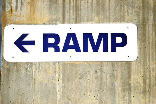 Ramp sign in front of a stadium.