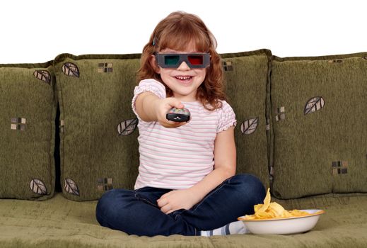 happy little girl with 3d glasses watching tv