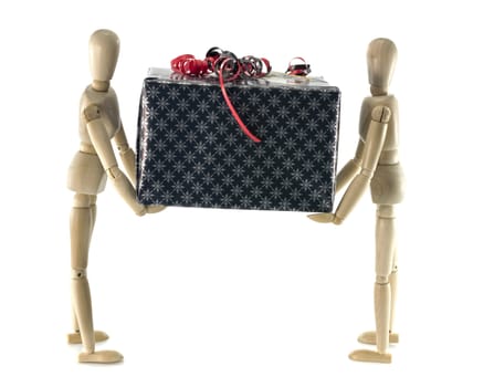 two wooden man holding a black present with red decoration