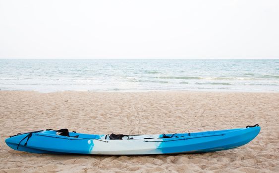 Colourful kayak on the beach