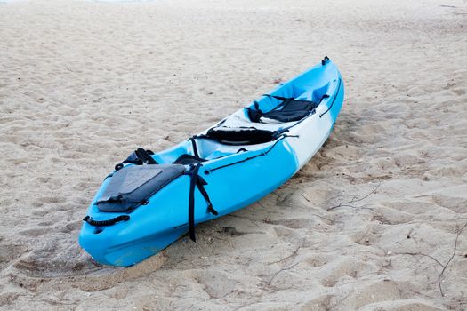 Colourful kayak on the beach