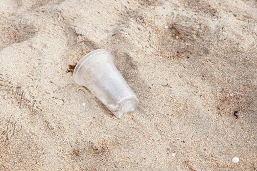 garbage plastic glass on the beach