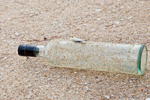 garbage bottle on the beach